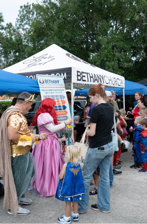 Volunteers preparing and serving food during an outreach event