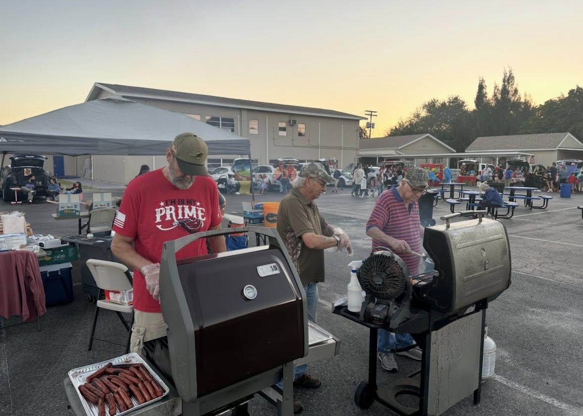Decorated trunk display with fall-themed treats at a community event