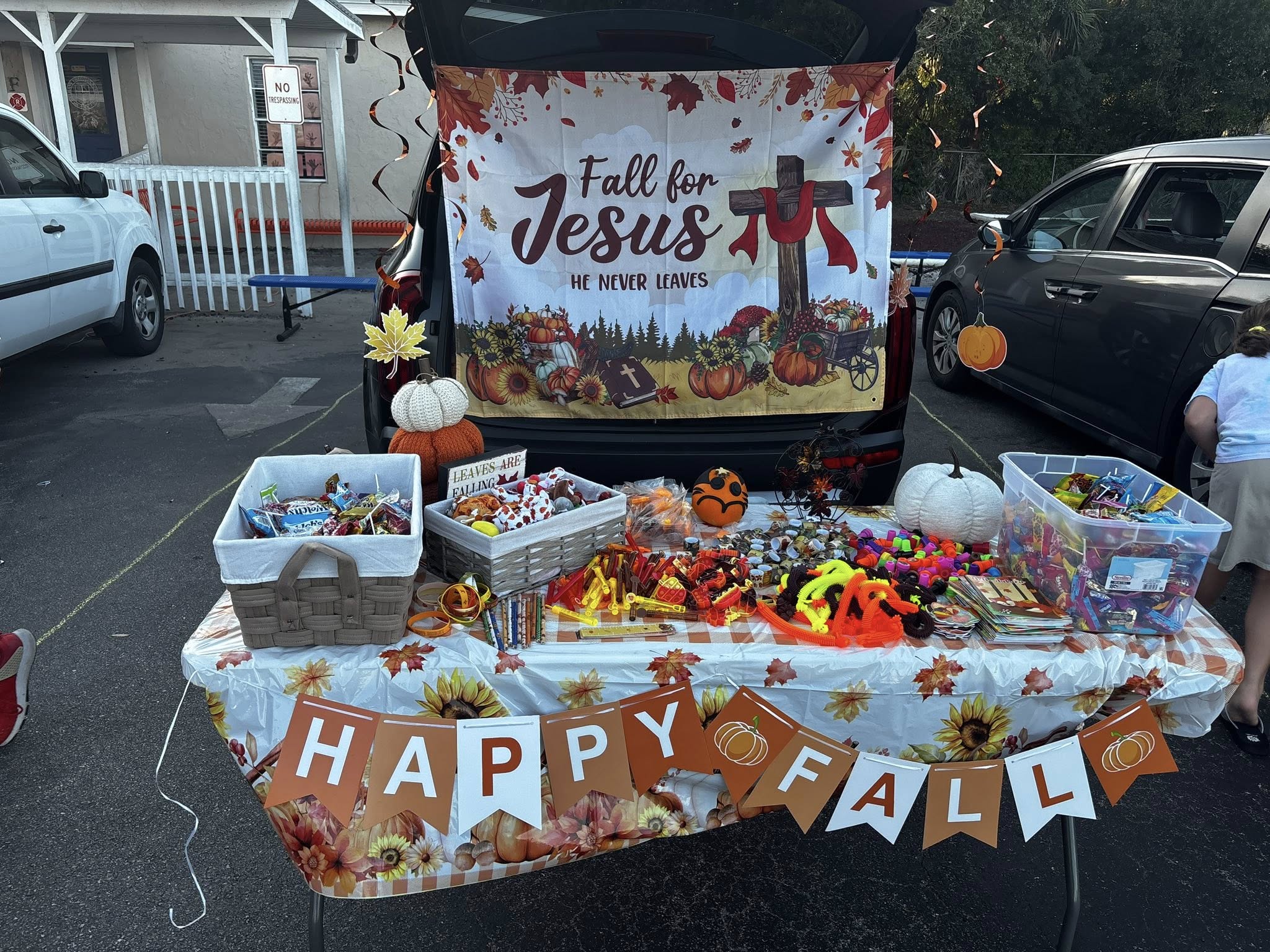 Children and families enjoying activities at a fall outreach event