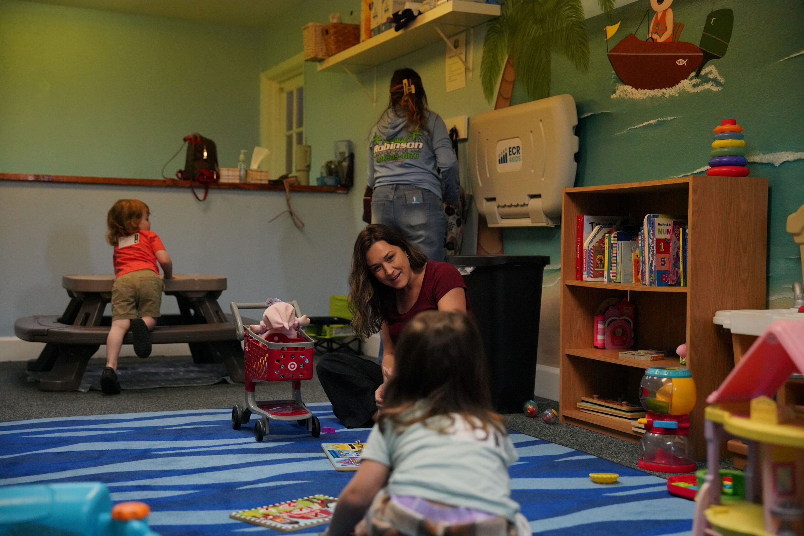 Volunteer caring for children in the Little Ones room at Bethany Church