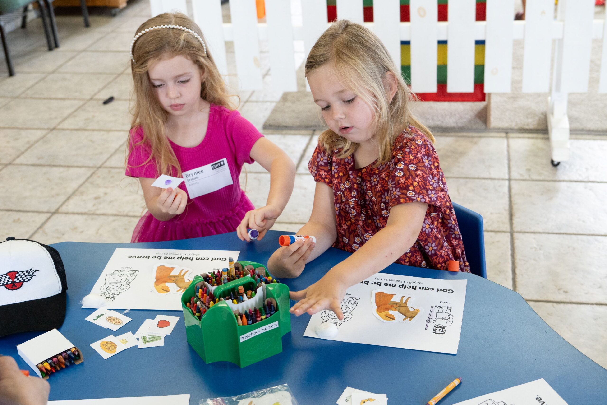 Children doing a craft activity together at a table in Little Ones