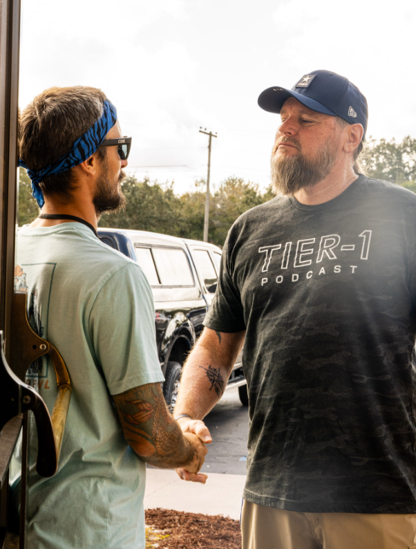 Two men greeting one another outside Bethany Church as part of authentic Christian brotherhood and connection in West Melbourne, Florida