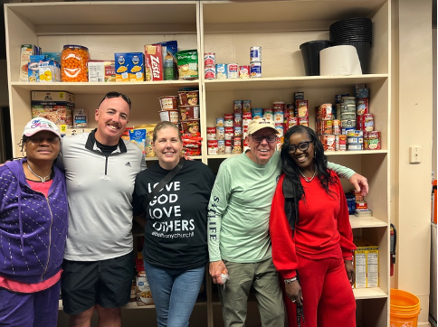 Volunteers preparing and organizing food at a local food pantry