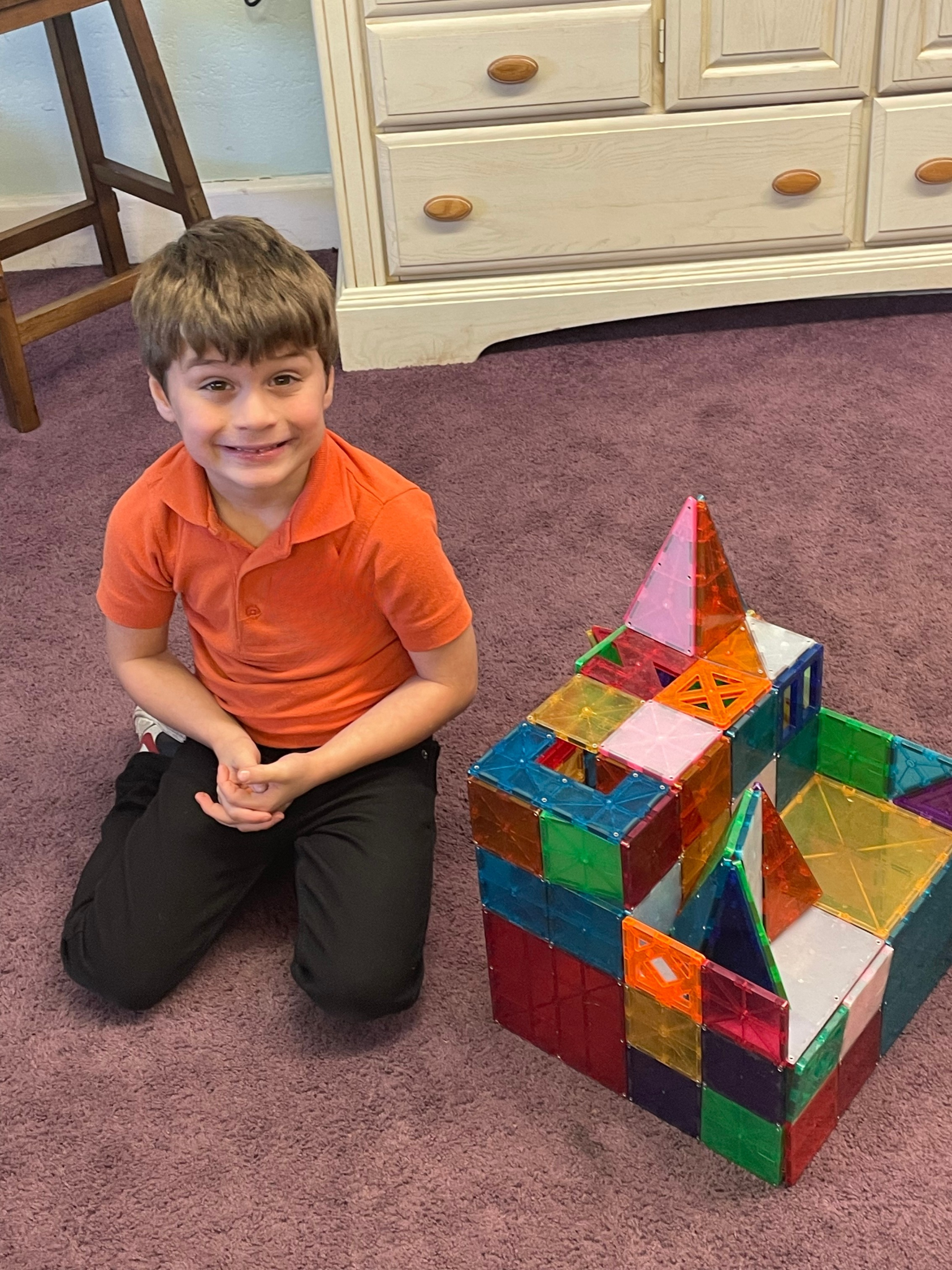 Child building with colorful magnetic tiles during SONbeams ministry at Bethany Church