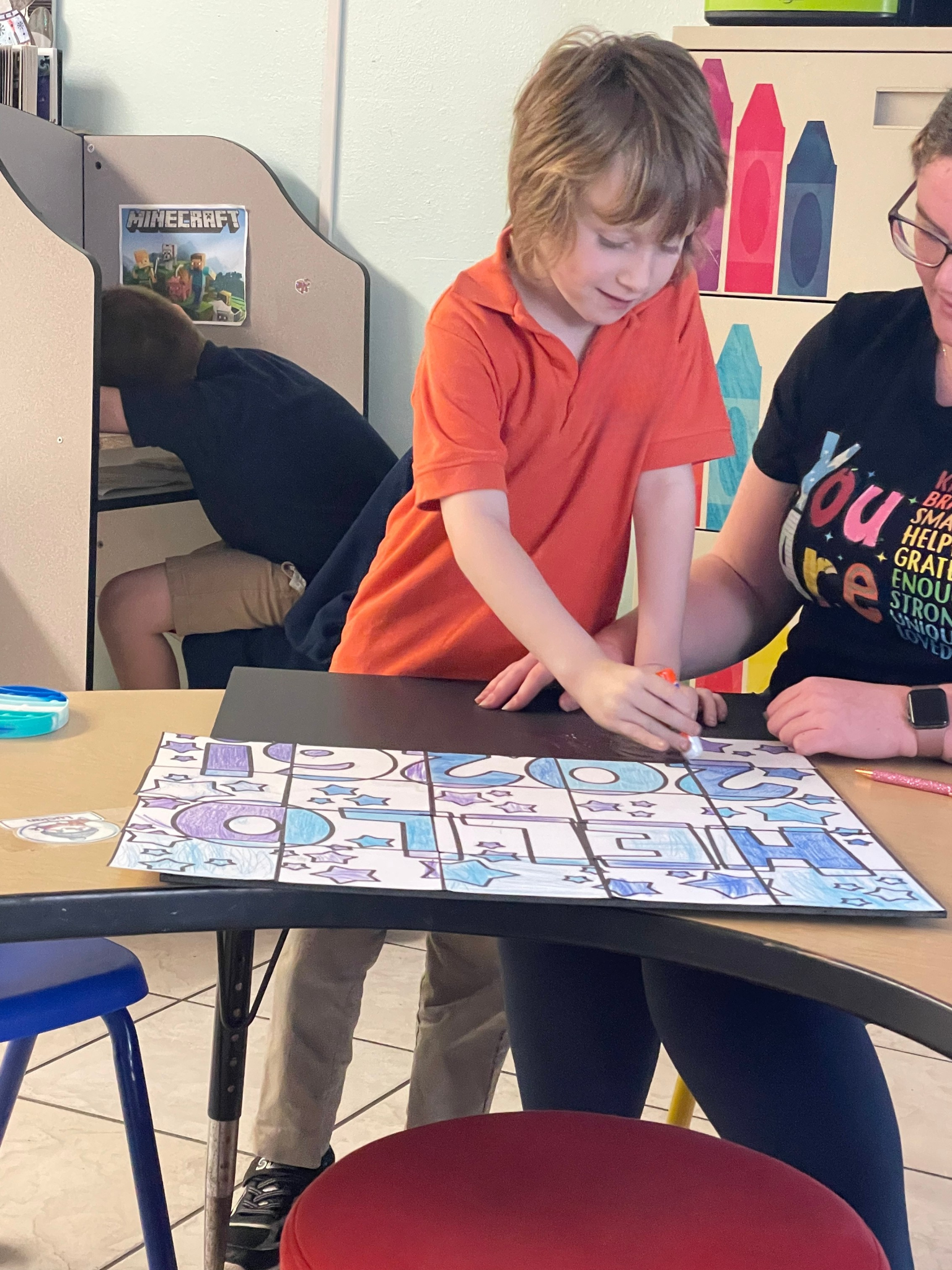 Children and volunteer enjoying a shared experience during SONbeams ministry at Bethany Church