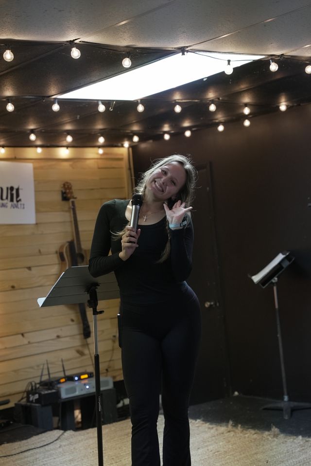 Young adult men greeting each other during a fellowship time at The Pursuit