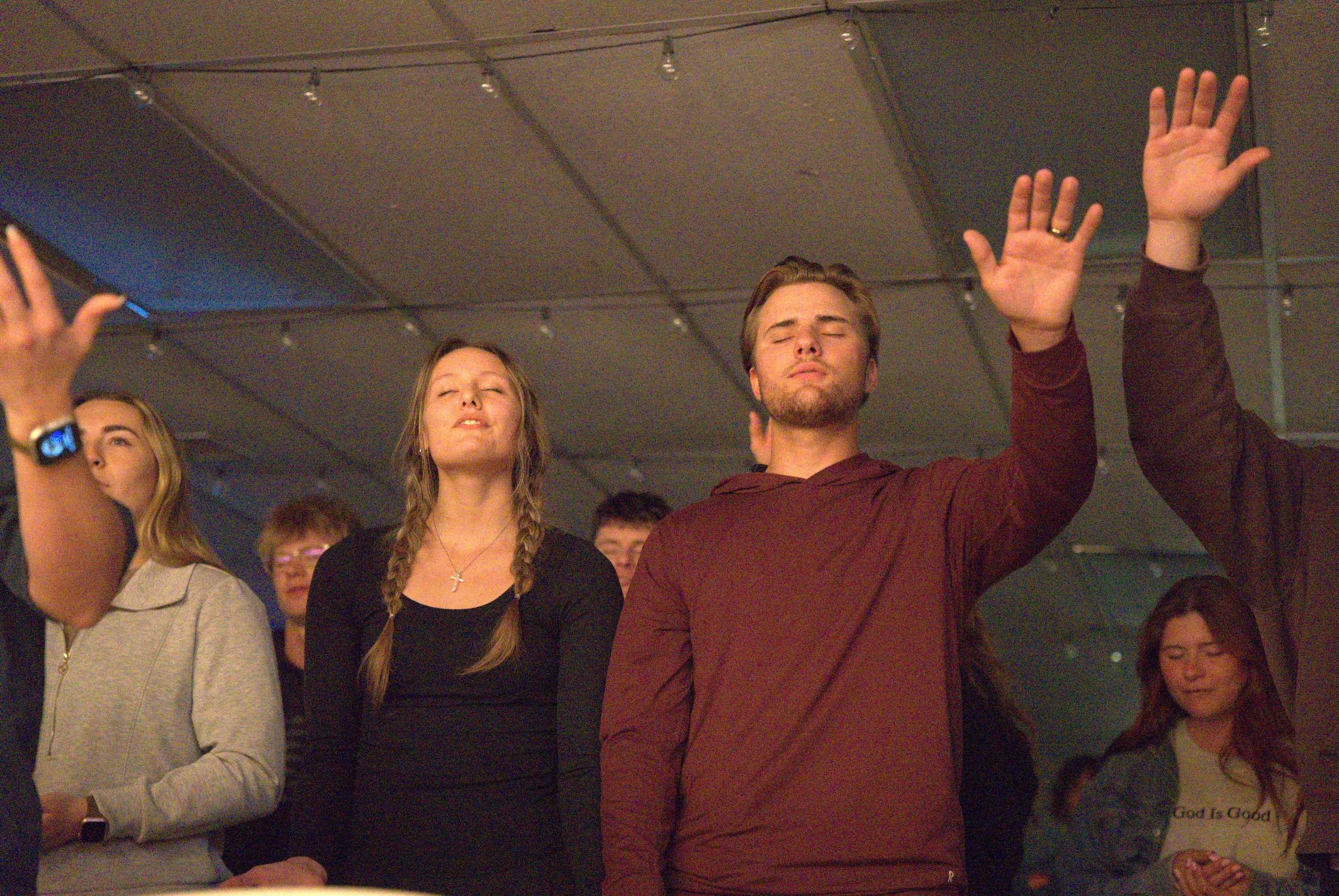 Young adults laughing and enjoying community during The Pursuit gathering