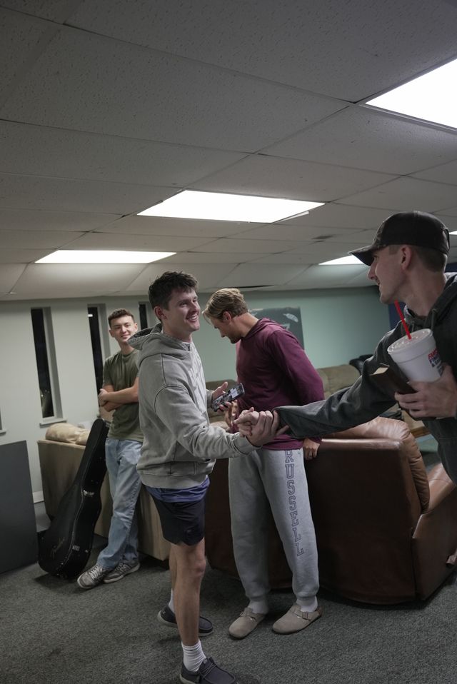 Young adults worshiping and engaging together during a special Pursuit gathering