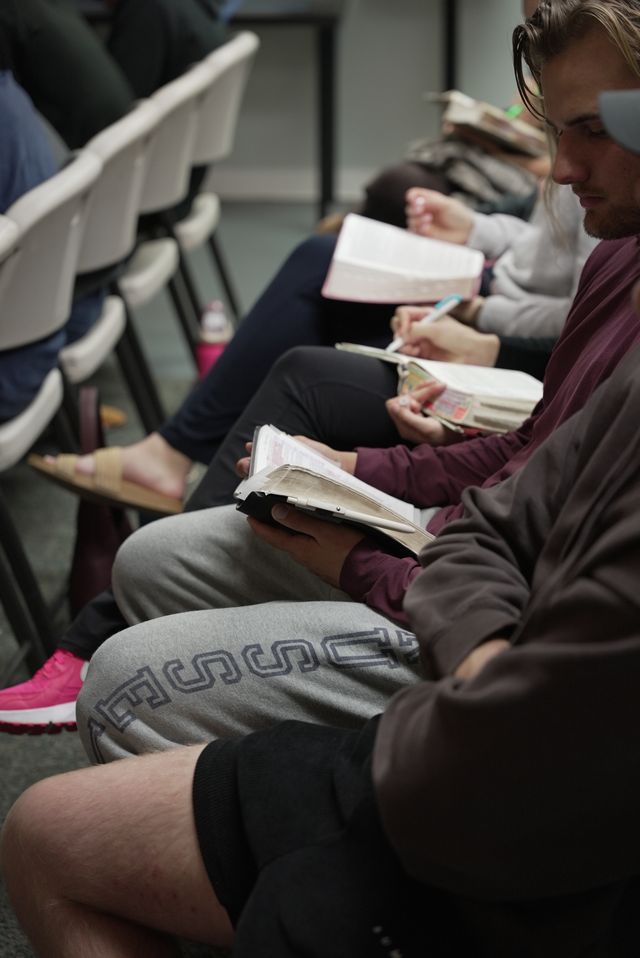 Young adults standing together in worship during The Pursuit at Bethany Church