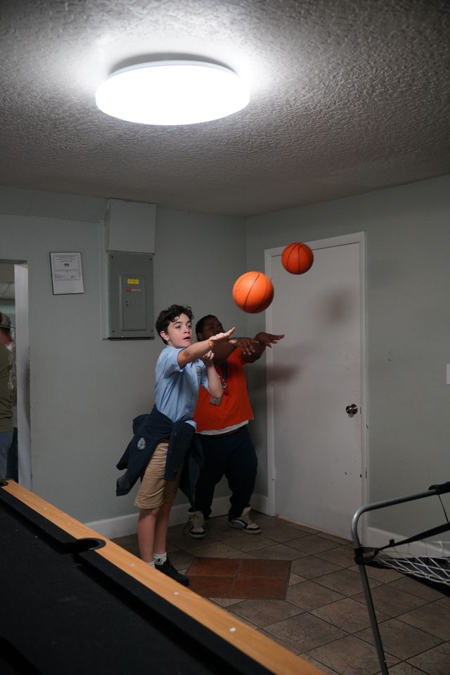 Students playing a basketball game together during a Bethany Youth event night