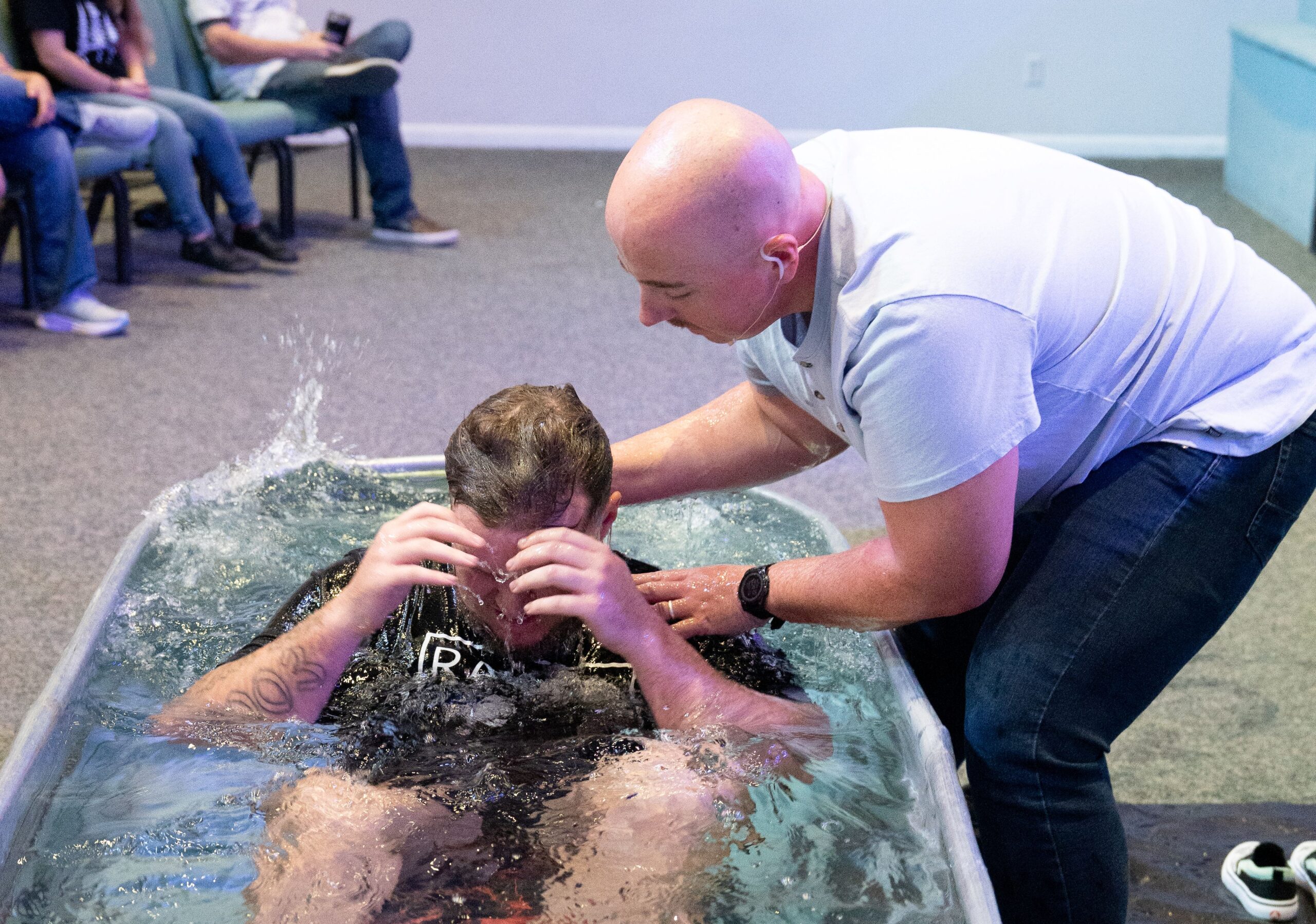 Man being baptized by immersion at Bethany Church in West Melbourne Florida
