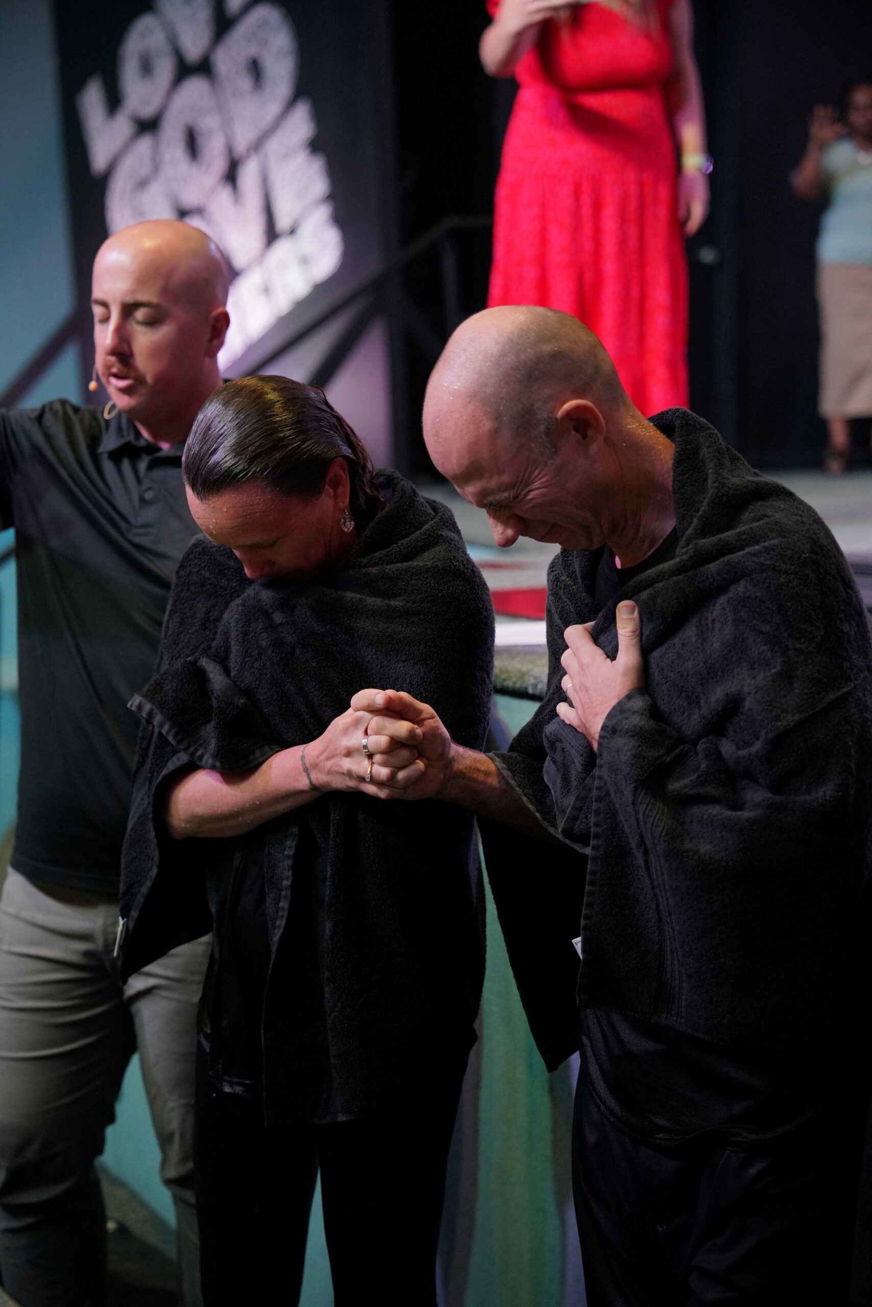 People praying together after baptism at Bethany Church in West Melbourne Florida