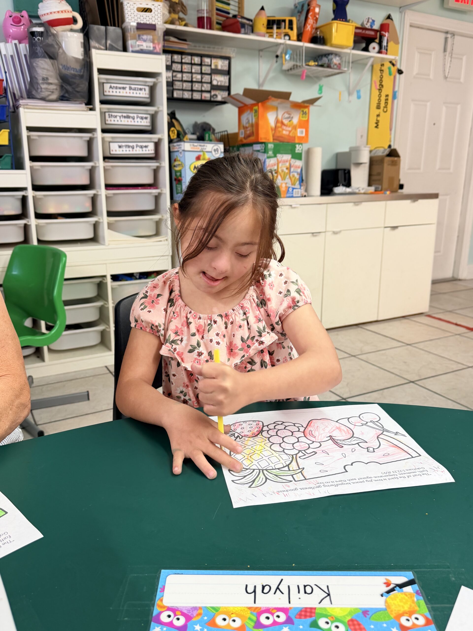 Child with unique abilities coloring during SONbeams ministry at Bethany Church in West Melbourne Florida